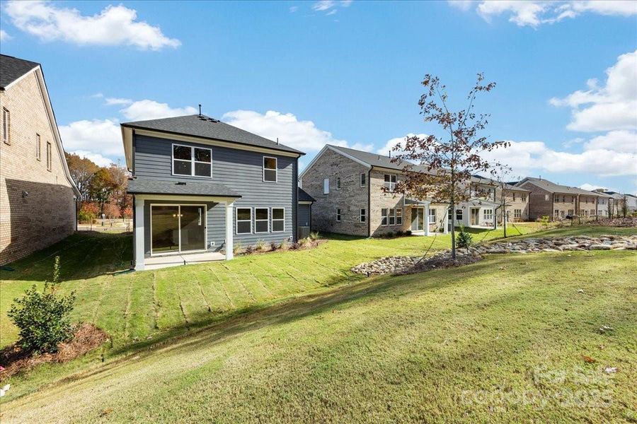 Rear Exterior Facing Tree-Lined Views.
