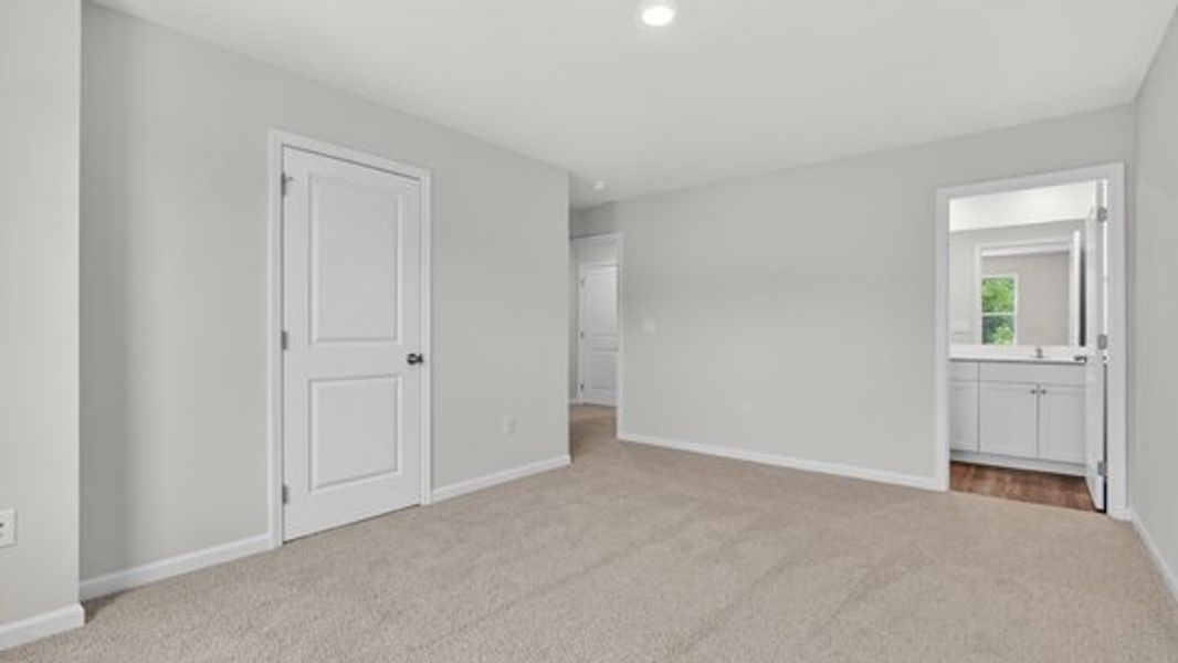 Spacious, unfurnished interior of a new home in The Townes at Belle Grove, Wendell (Image 14).