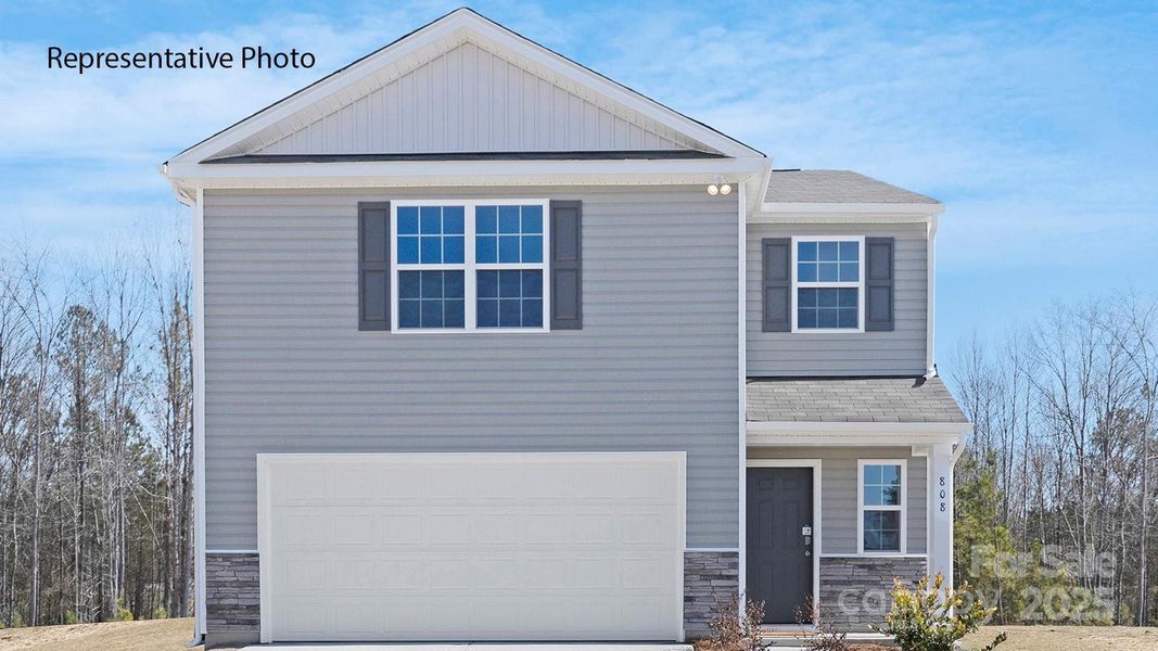 Front exterior of a new home in Woodhaven at Chester, Chester, SC, highlighting curb appeal (Image 1).