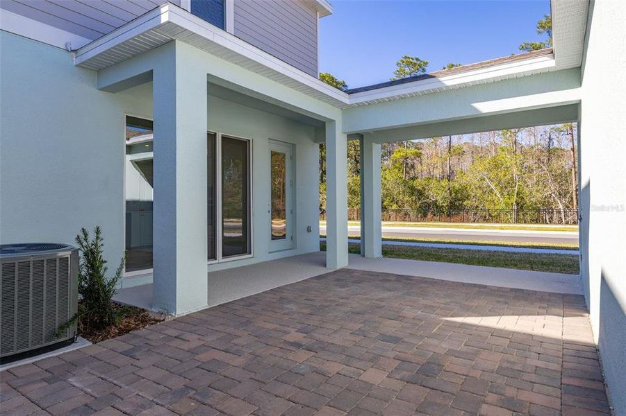 Exterior details and patio area of a home in Serenade at Ovation, Winter Garden (Image 3).