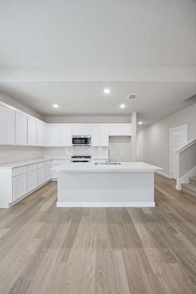 Kitchen in the Stanley II home plan by Trophy Signature Homes – REPRESENTATIVE PHOTO Kitchen in the Stanley II home plan by Trophy Signature Homes – REPRESENTATIVE PHOTO