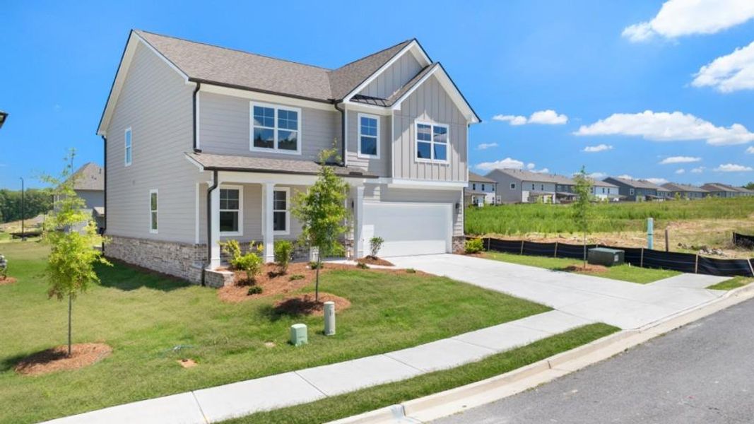 Front exterior of a new home in Hamptons at Riverwood South, Dallas, GA, highlighting curb appeal (Image 2). Front exterior of a new home in Hamptons at Riverwood South, Dallas, GA, highlighting curb appeal (Image 2).