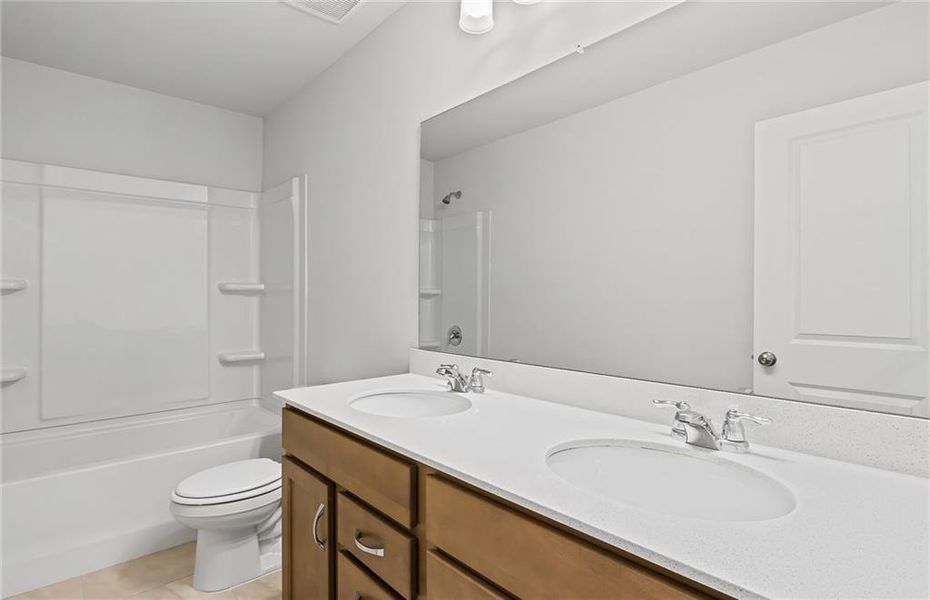 Furnished interior view inside a new home in Watermist at Mirror Lake, Villa Rica (Image 9).