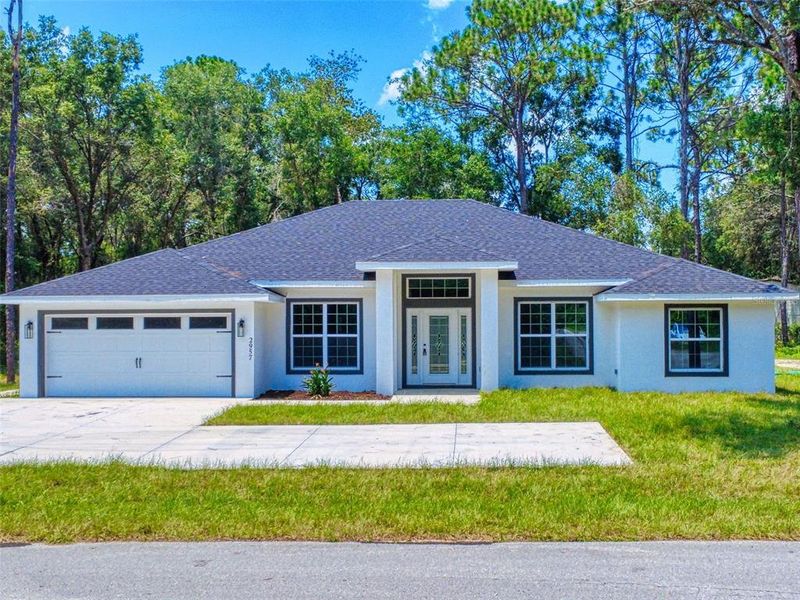 Front exterior of a new home in , Inverness, FL, highlighting curb appeal (Image 27).