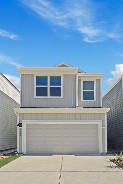 Front exterior of a new home in Bridges on Lake Houston Villas, Humble, TX, highlighting curb appeal (Image 2). Front exterior of a new home in Bridges on Lake Houston Villas, Humble, TX, highlighting curb appeal (Image 2).