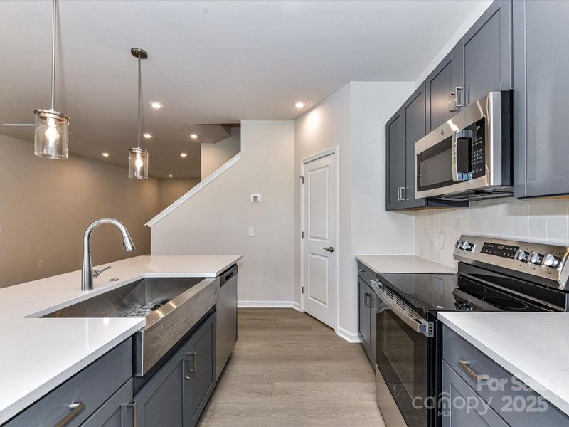 Modern Stainless Single Basin Sink and Pendant Lighting.