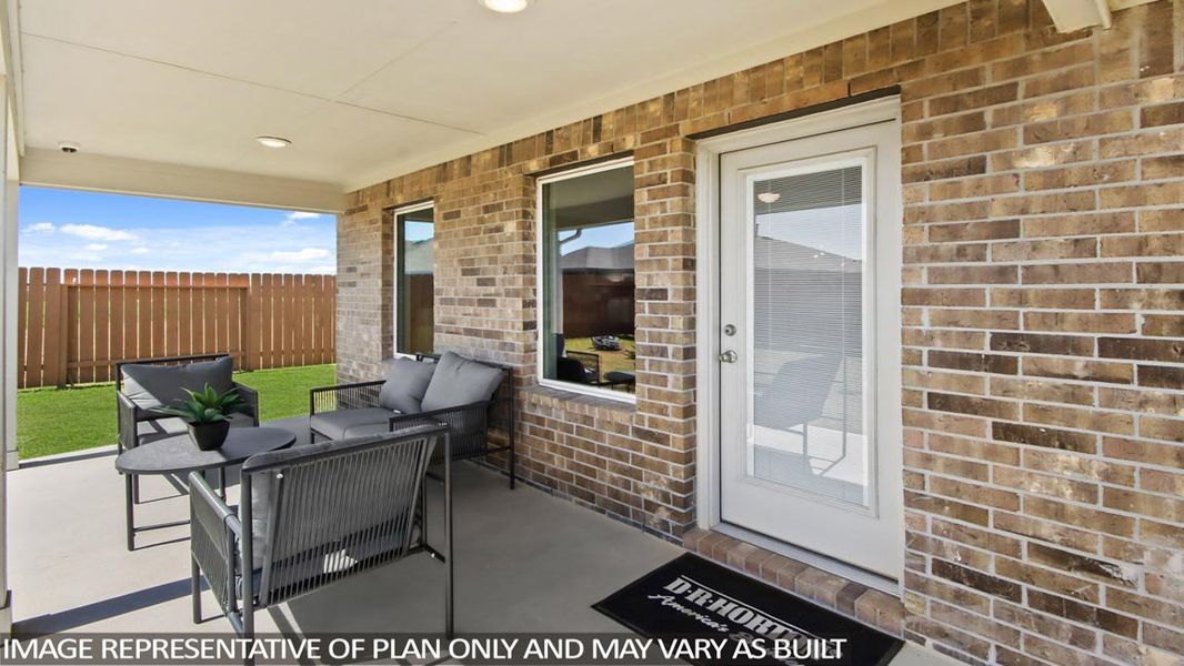 Exterior details and patio area of a home in Sunterra, Katy (Image 2).