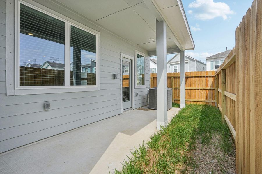 Exterior details and patio area of a home in Kemah Crossing - City Series, Kemah (Image 2). Exterior details and patio area of a home in Kemah Crossing - City Series, Kemah (Image 2).