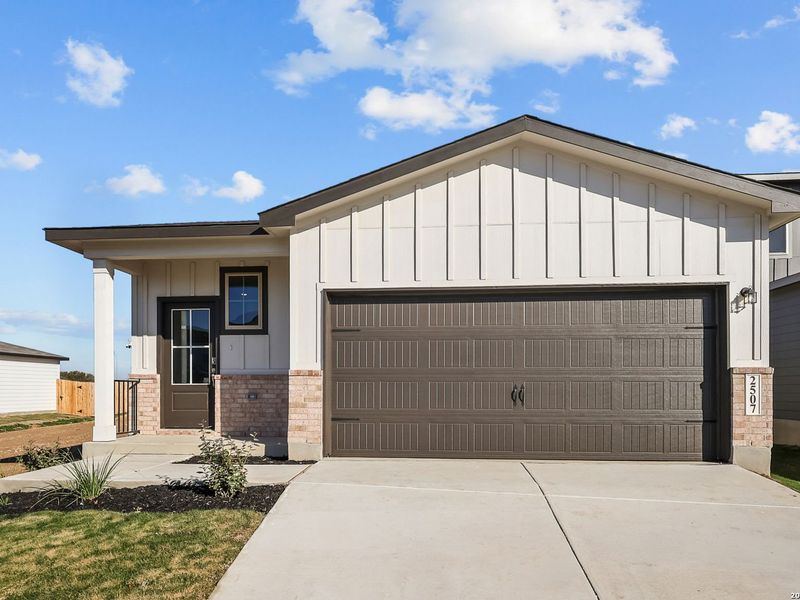 Front exterior of a new home in Applewhite Meadows, San Antonio, TX, highlighting curb appeal (Image 2). Front exterior of a new home in Applewhite Meadows, San Antonio, TX, highlighting curb appeal (Image 2).