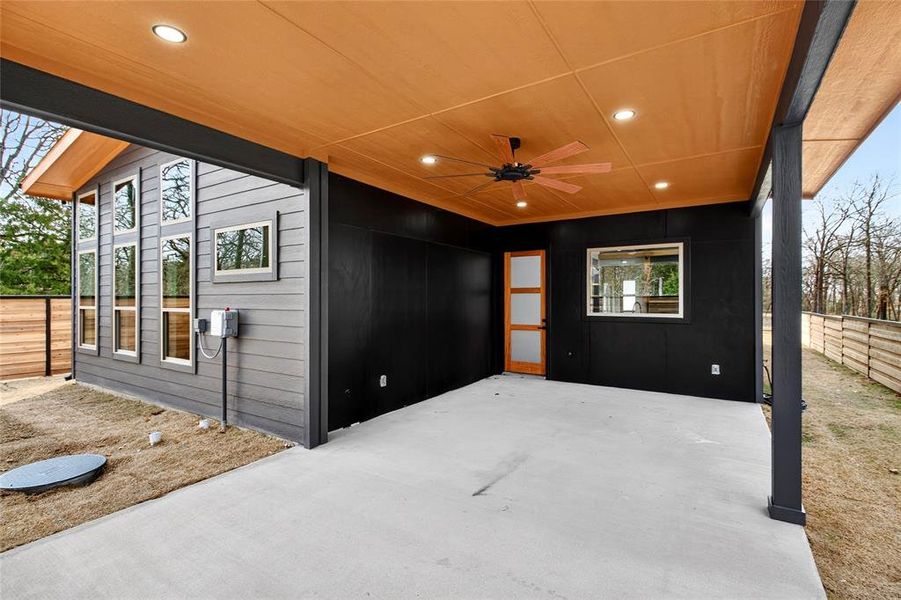 View of patio featuring ceiling fan