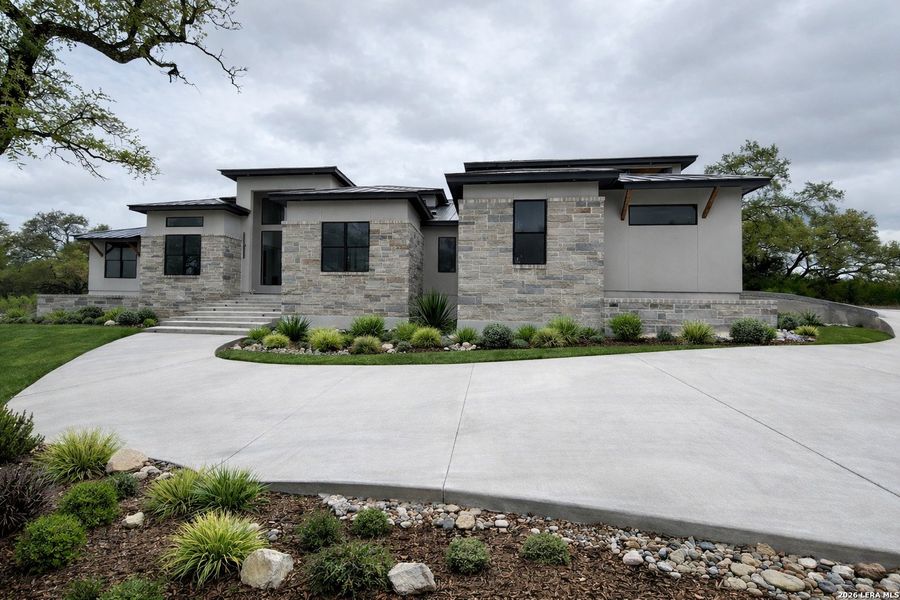 Front exterior of a new home in , Boerne, TX, highlighting curb appeal (Image 4).
