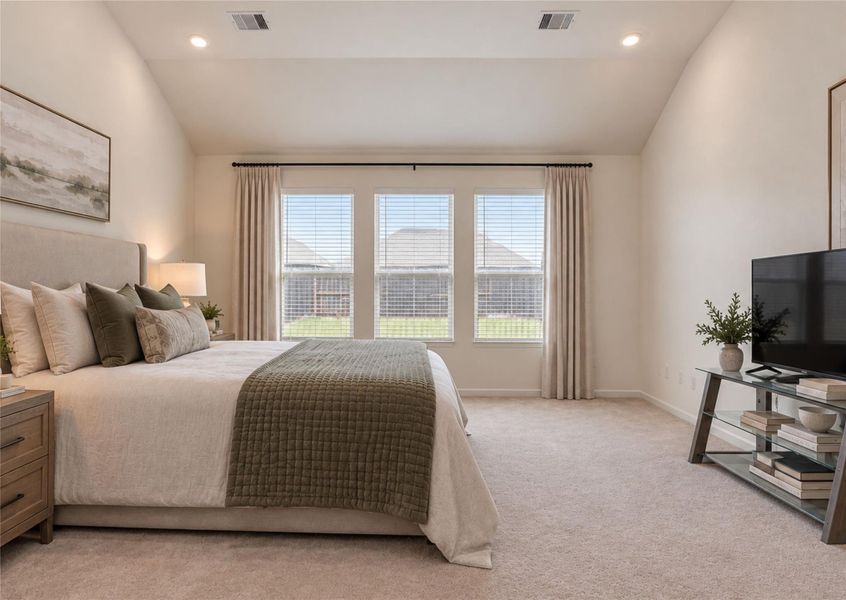 Primary bedroom, virtually staged to show potential, this room features high ceilings, recessed lighting, and large windows looking out to the backyard.