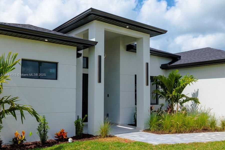 Front exterior of a new home in , Cape Coral, FL, highlighting curb appeal (Image 1).