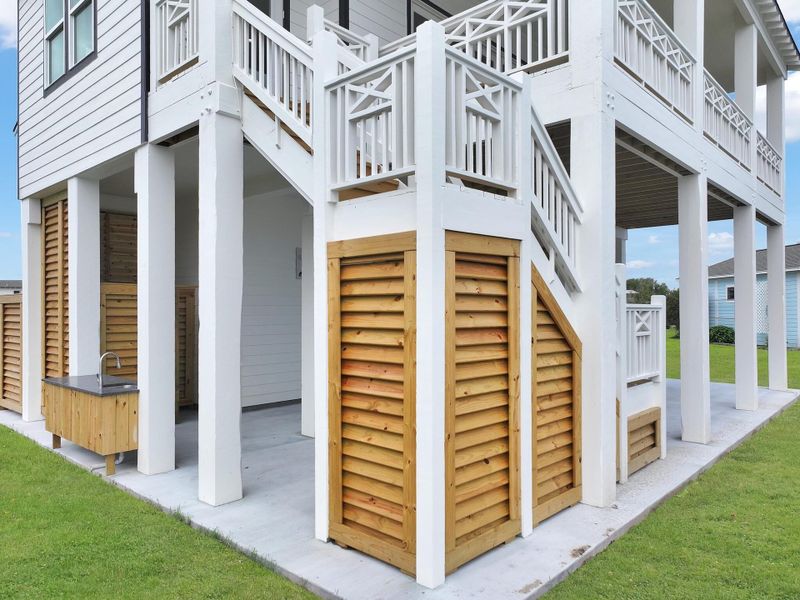 Louvered storage area on backside of house