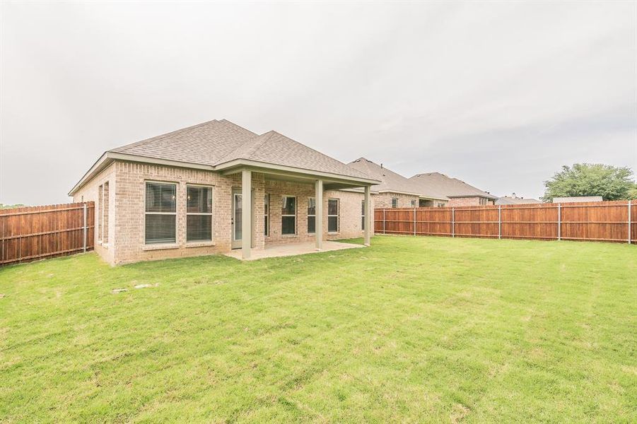 Front exterior of a new home in , Alvarado, TX, highlighting curb appeal (Image 22).