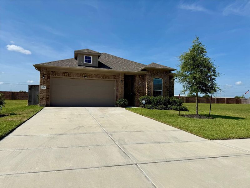 Front exterior of a new home in , Angleton, TX, highlighting curb appeal (Image 29).