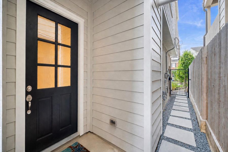 The private gated side entry leads from the front of the home to the backyard — a thoughtful detail that adds both security and convenience to everyday coming and going. The private gated side entry leads from the front of the home to the backyard — a thoughtful detail that adds both security and convenience to everyday coming and going.