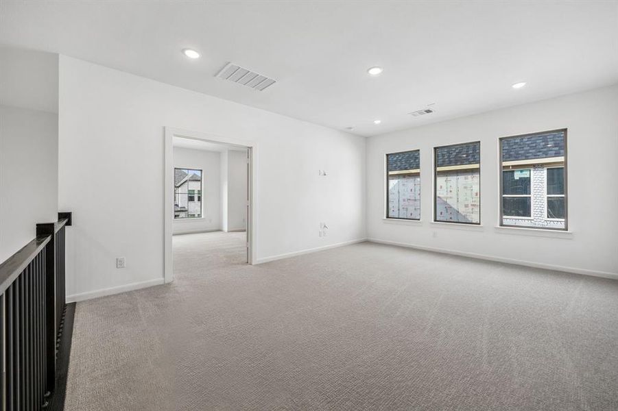 The kiddos will love entertaining their friends in this over-the-top game room with adjacent media room.