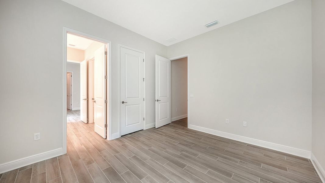Spacious, unfurnished interior of a new home in Canoe Creek Real Estate and Homes for Sale in Parrish, FL - Neal Communities, Parrish (Image 59).