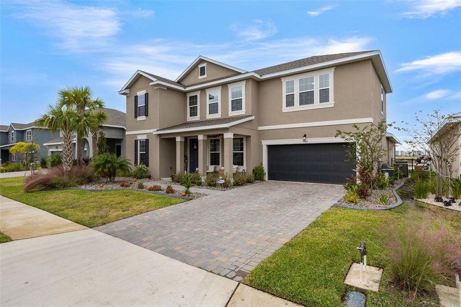 Front exterior of a new home in Seaire, Parrish, FL, highlighting curb appeal (Image 26).