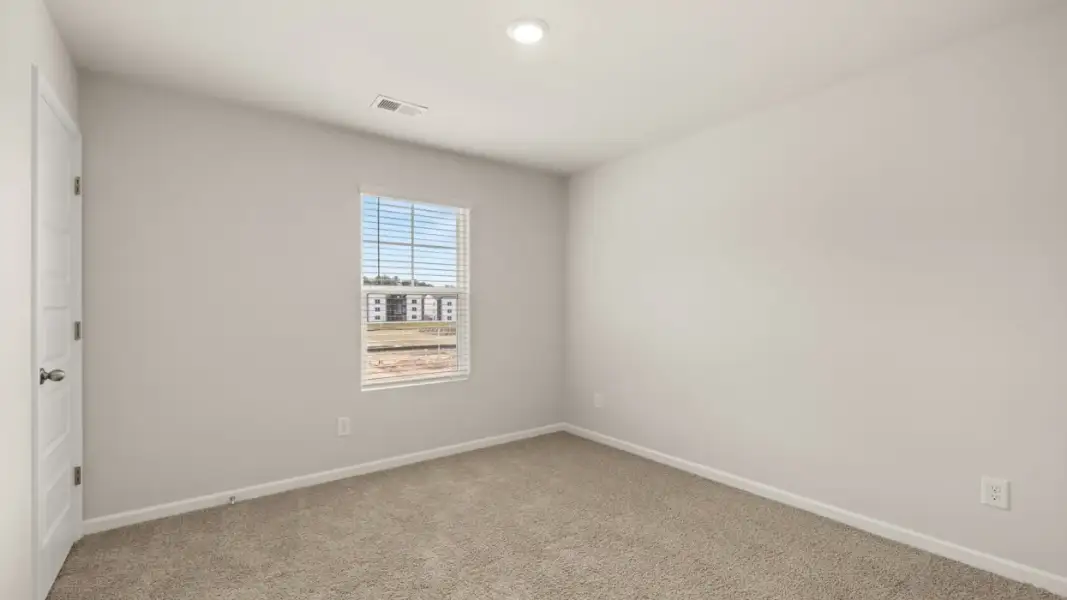 Representative unfurnished interior of a home built from the Ansley by D.R. Horton in Stillwater Lake Oconee, Eatonton (Image 28).