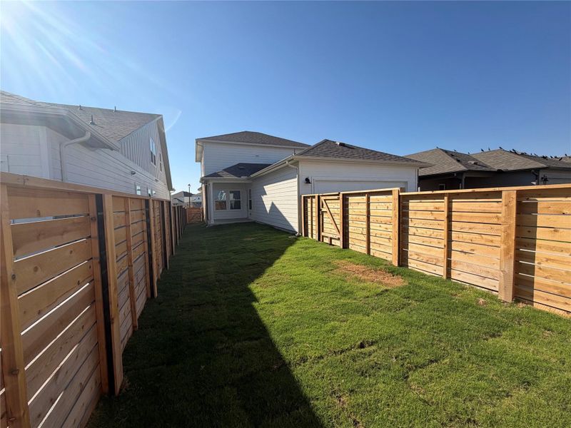 View of fenced backyard