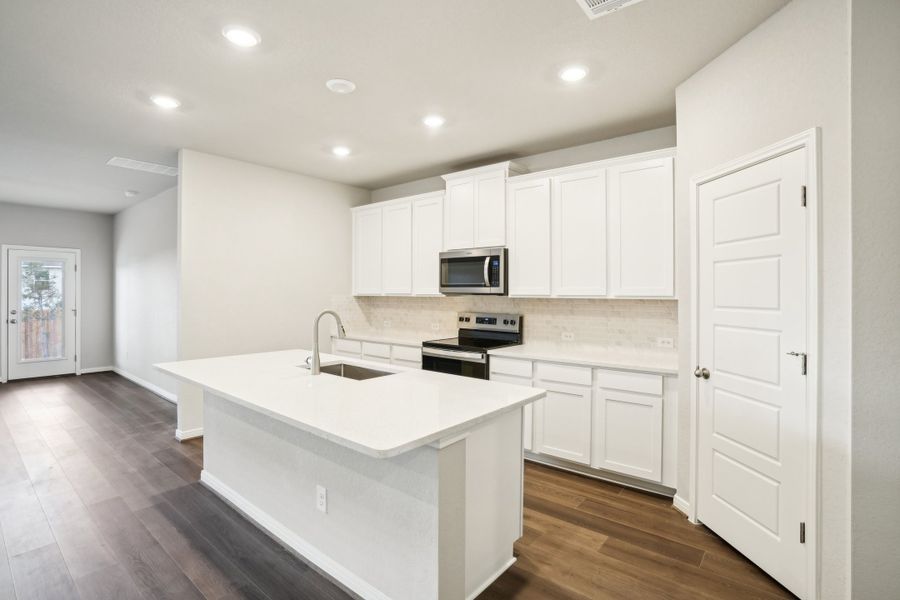 Kitchen of the Reynolds floorplan at a Meritage Homes community.