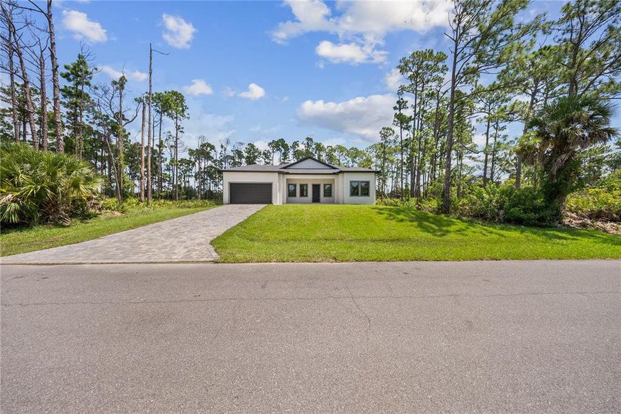 Front exterior of a new home in , Port Charlotte, FL, highlighting curb appeal (Image 34). Front exterior of a new home in , Port Charlotte, FL, highlighting curb appeal (Image 34).