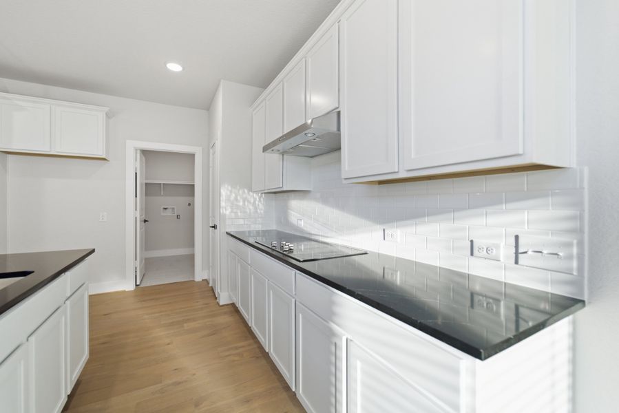 Furnished interior view inside a new home in The Woodlands at Medina Hills, Mico (Image 11).