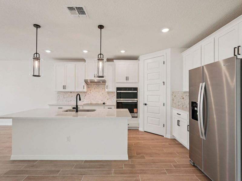 Furnished interior view inside a new home in Oakfield Trails - Signature Series, Parrish (Image 6). Furnished interior view inside a new home in Oakfield Trails - Signature Series, Parrish (Image 6).