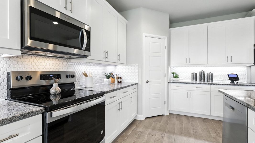 Representative furnished interior of a home built from the Blanco by D.R. Horton in Lakeview Pointe, Grand Prairie (Image 16).