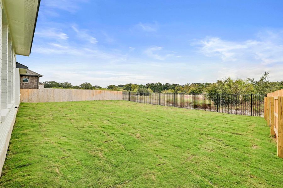 Exterior details and patio area of a home in Santa Rita Ranch - 60', Liberty Hill (Image 4).