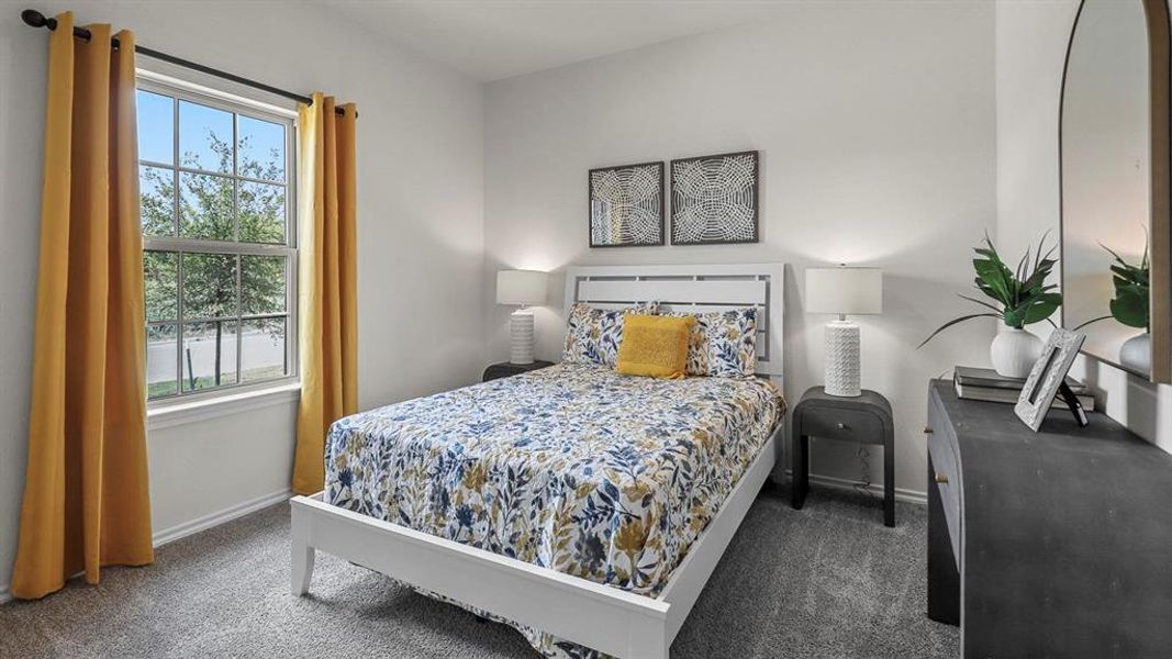 Bedroom with dark colored carpet