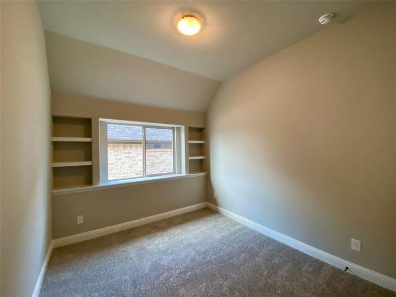 Bed 3 with vaulted ceiling & built-in shelves Bed 3 with vaulted ceiling & built-in shelves