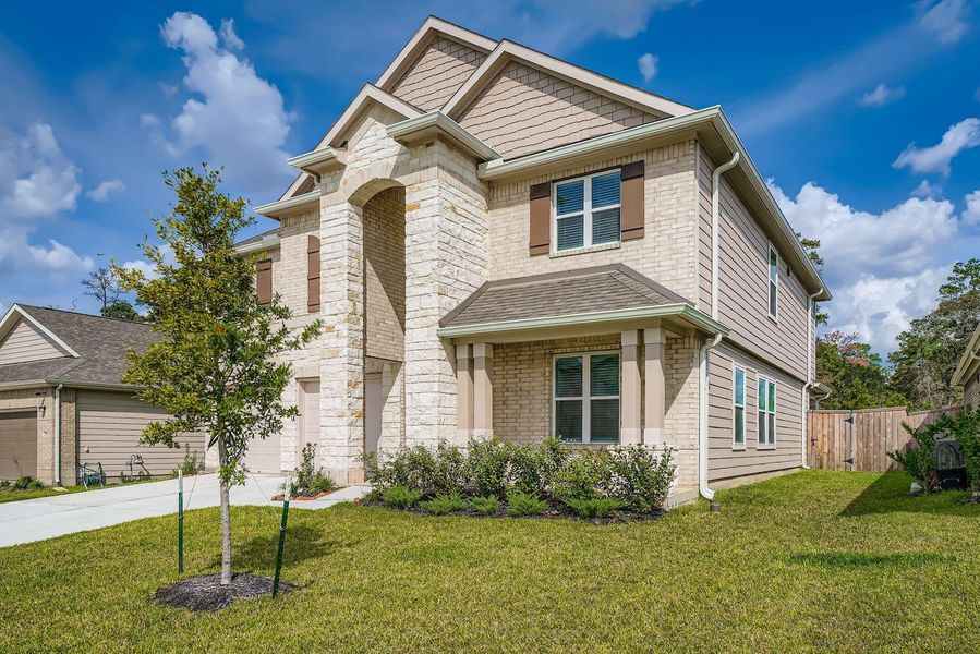Front exterior of a new home in , Spring, TX, highlighting curb appeal (Image 20).