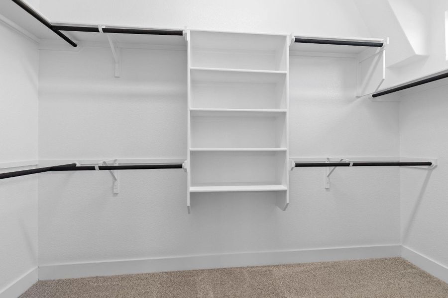 Walk-in closet in Primary Bedroom Walk-in closet in Primary Bedroom