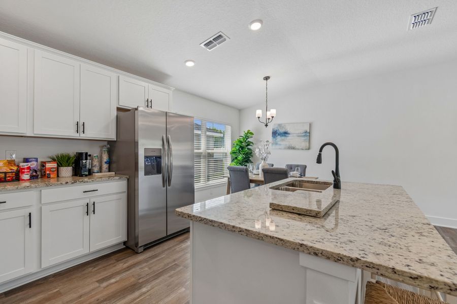 Representative furnished interior of a home built from the 1515 by Adams Homes in Winding Oaks, Weeki Wachee (Image 14).