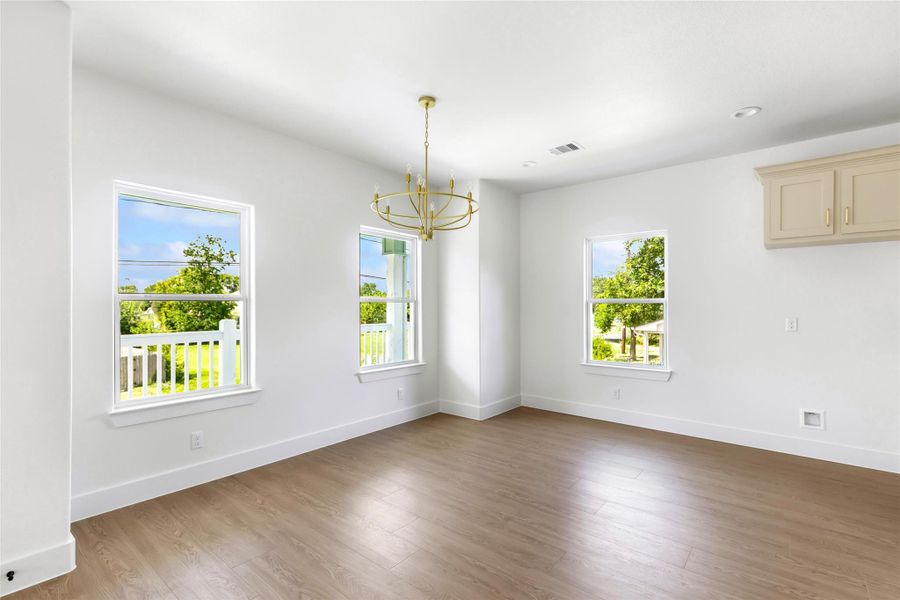 Bright breakfast nook with natural light and views.