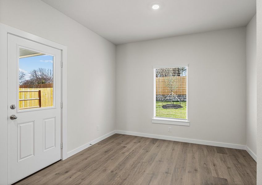 The dining room has large windows that let in great, natural light.