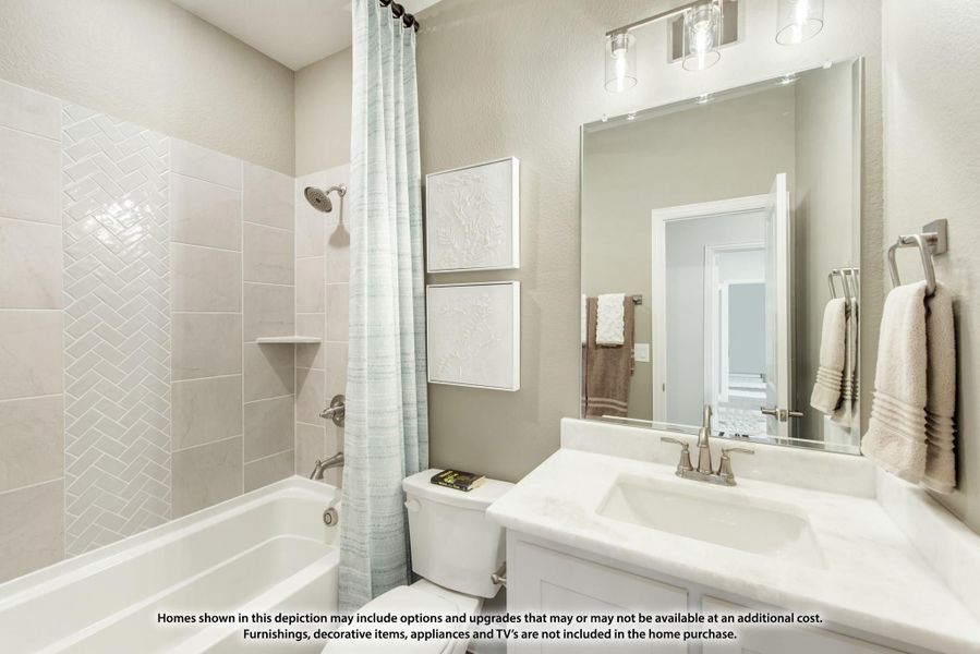 Bathroom with herringbone tile tub surround, white vanity, large mirror, and shower curtain