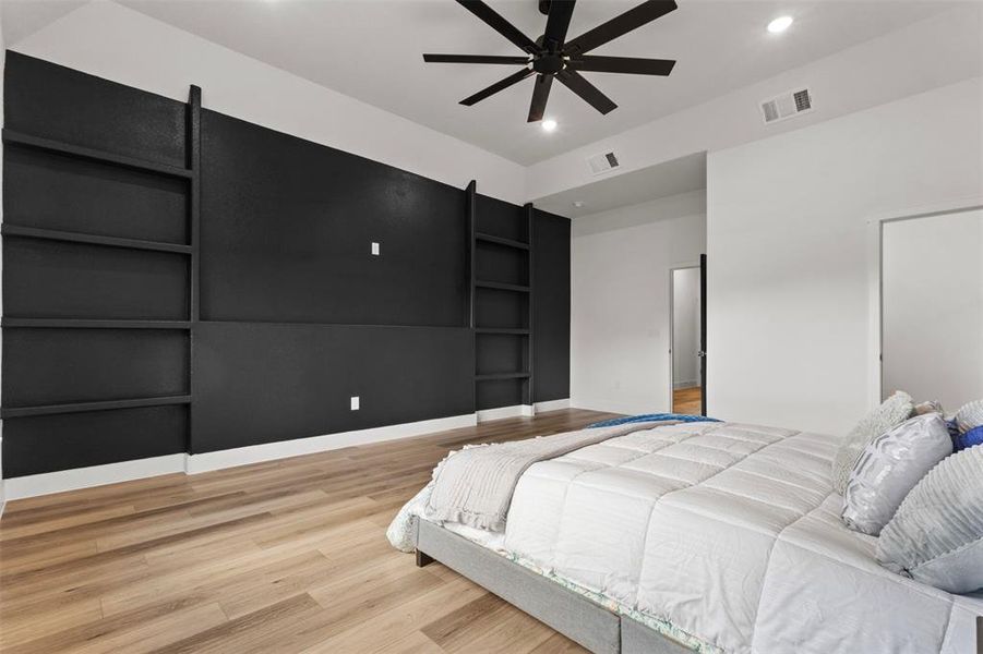 Bedroom with light wood-type flooring, a ceiling fan, and recessed lighting