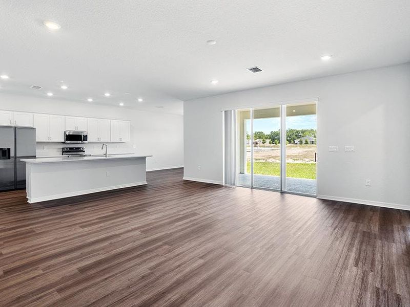 Enjoy a light-filled open living area - Everly by Highland Homes