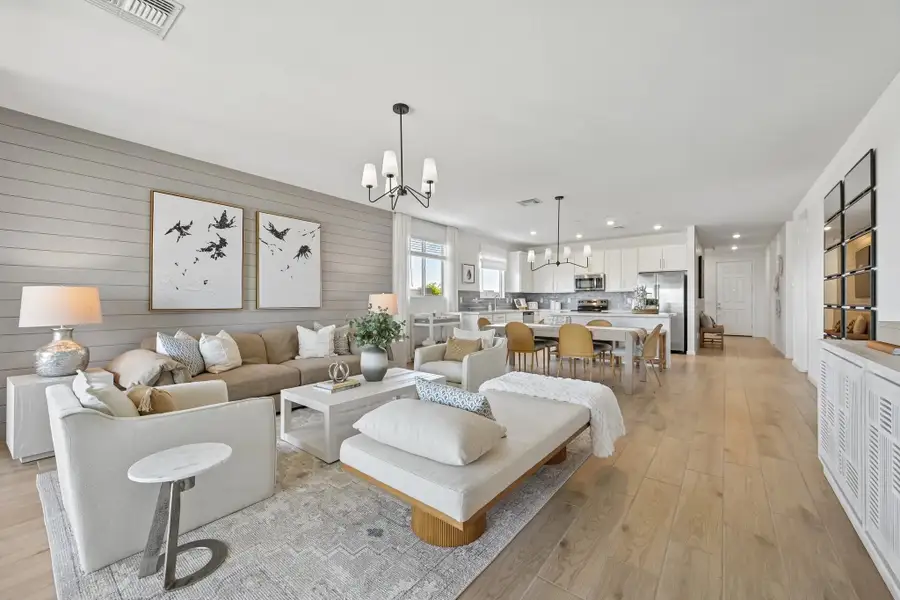 Great room and kitchen. Model home, finishes may vary. Great room and kitchen. Model home, finishes may vary.