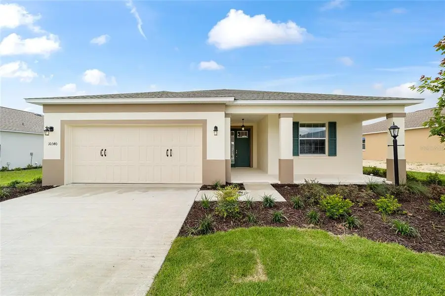 Front exterior of a new home in , Ocala, FL, highlighting curb appeal (Image 2). Front exterior of a new home in , Ocala, FL, highlighting curb appeal (Image 2).