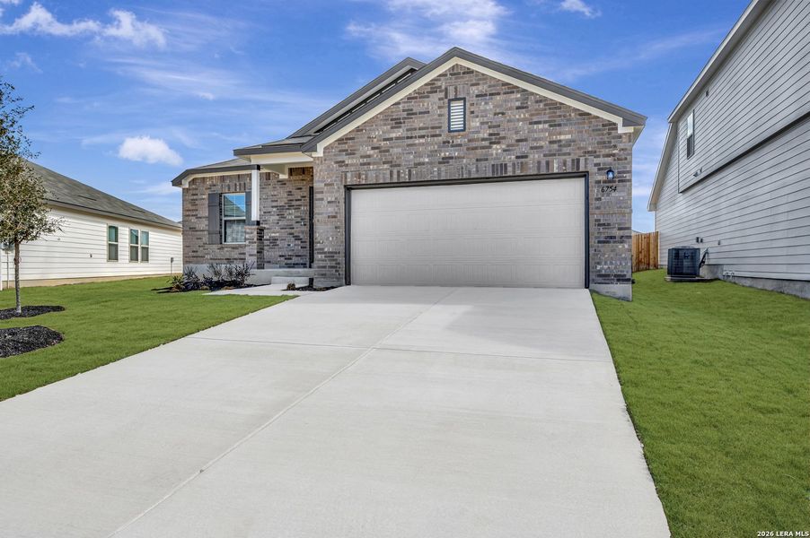 Front exterior of a new home in Winding Brook, San Antonio, TX, highlighting curb appeal (Image 1). Front exterior of a new home in Winding Brook, San Antonio, TX, highlighting curb appeal (Image 1).