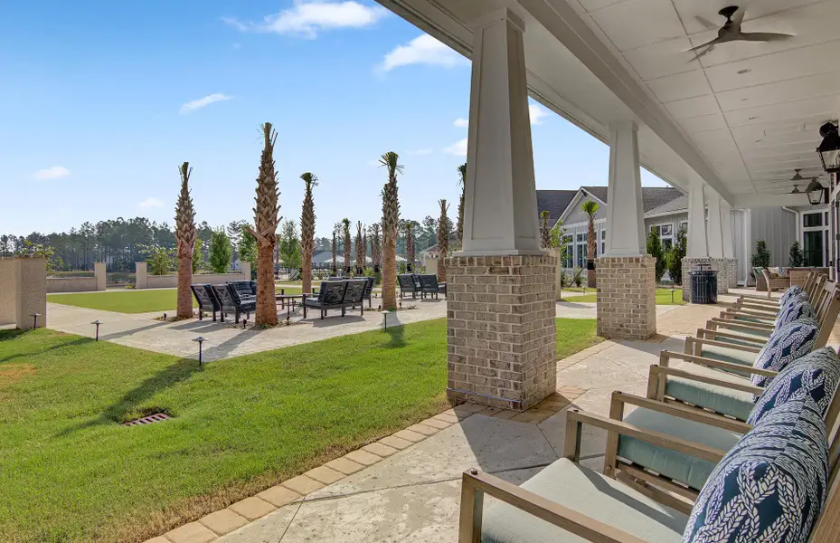 Exterior details and patio area of a home in K. Hovnanian's® Four Seasons at Lakes of Cane Bay, Summerville (Image 29).