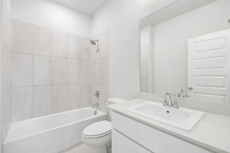 Bathroom in the Winters home plan by Trophy Signature Homes – REPRESENTATIVE PHOTO