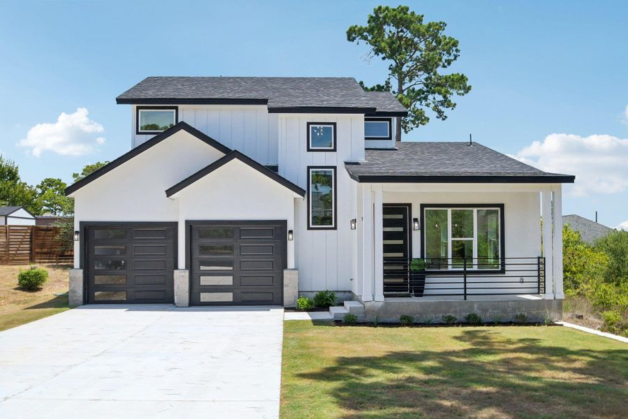 Bold black trim contrasts beautifully with crisp white siding on this modern two-story home. Bold black trim contrasts beautifully with crisp white siding on this modern two-story home.