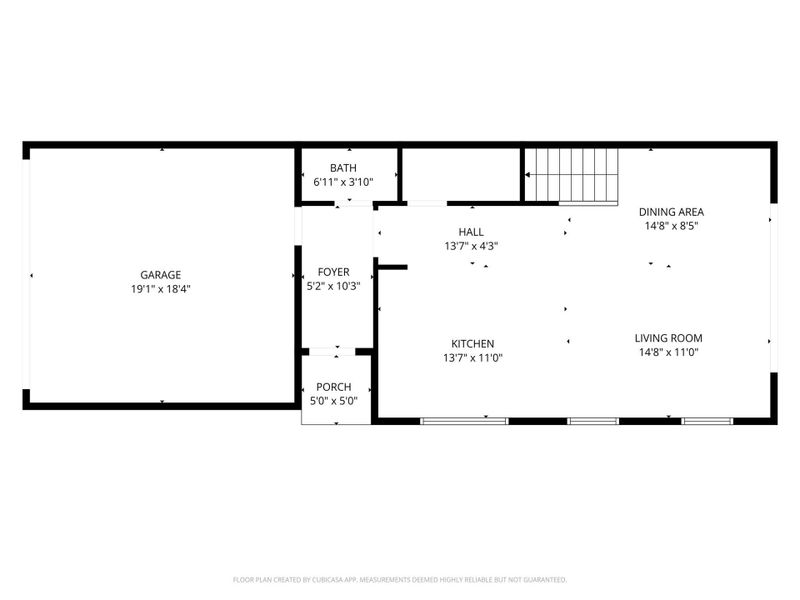 This floor plan features a spacious garage, a welcoming foyer leading to a kitchen and living room, a dining area, a small bathroom, and an entry porch. The layout offers a functional flow for everyday living.