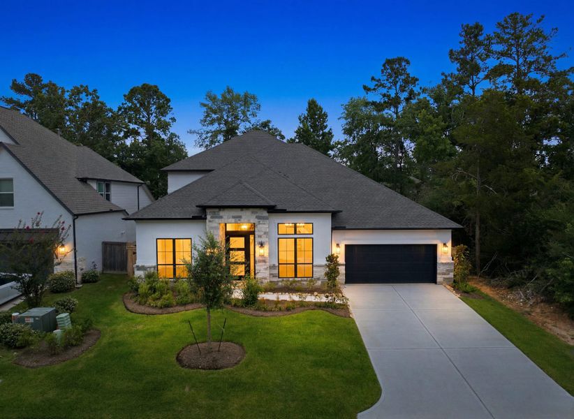 Front exterior of a new home in The Woodlands Hills 65′, Willis, TX, highlighting curb appeal (Image 25). Front exterior of a new home in The Woodlands Hills 65′, Willis, TX, highlighting curb appeal (Image 25).